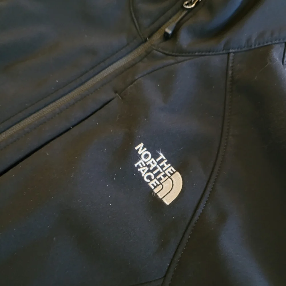 The North Face black zip up jacket